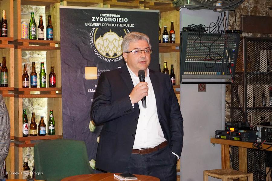 Greece on its Way to Develop and Promote Beer Tourism - Gastronomy Tours a man speaks at a microphone Gastronomy Tours - Gastronomy Tours